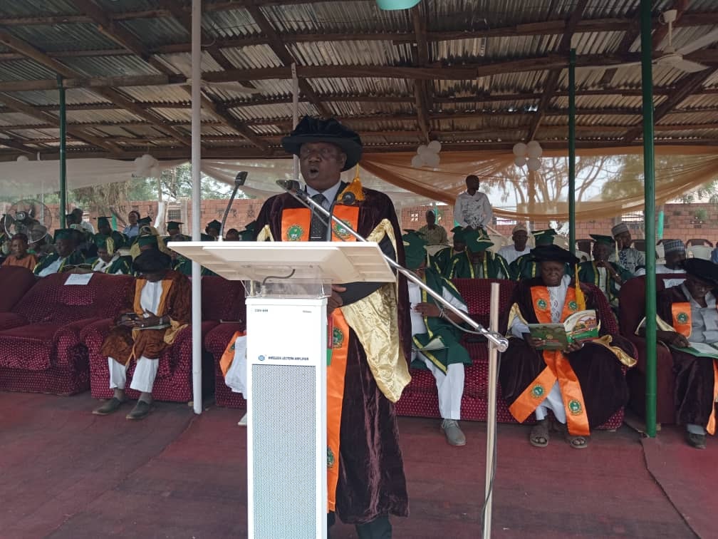 the registrar addressing the graduands